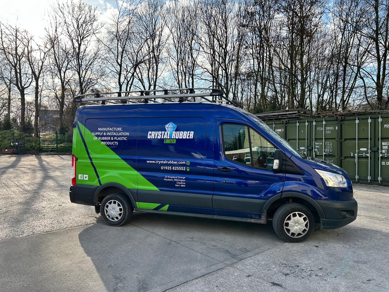 Crystal Rubber delivery van parked outside Warrington HQ, showing company branding and contact details