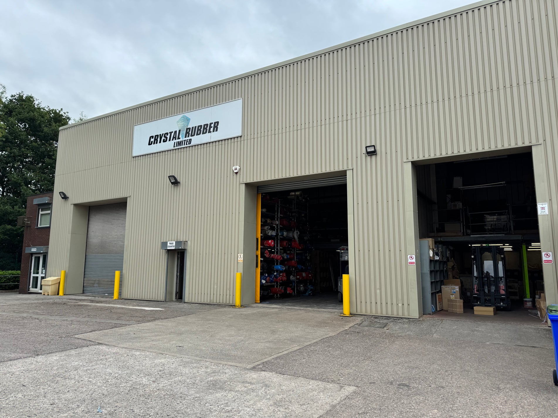 Large industrial building with 'Crystal Rubber Limited' sign