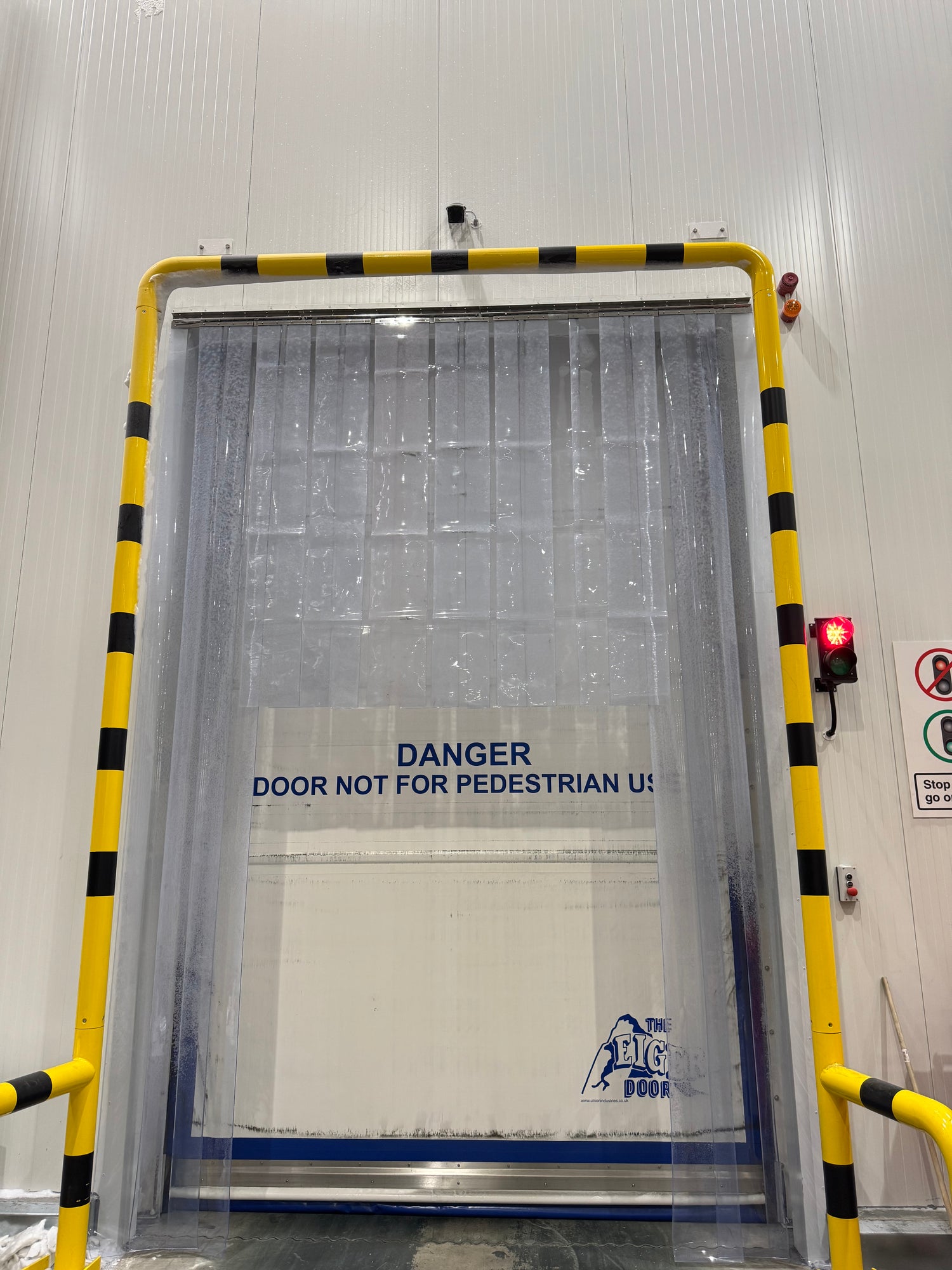 PVC strip curtain with stainless steel rails during installation