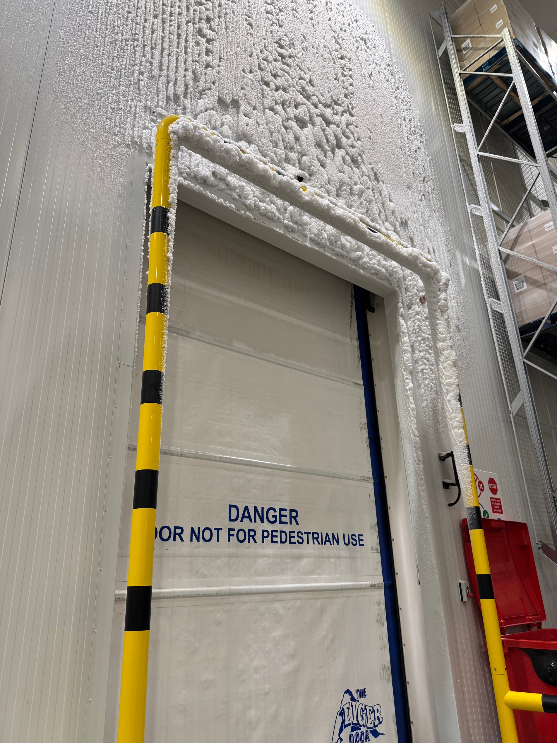 Severe ice build-up around cold store entrance before solution was installed.