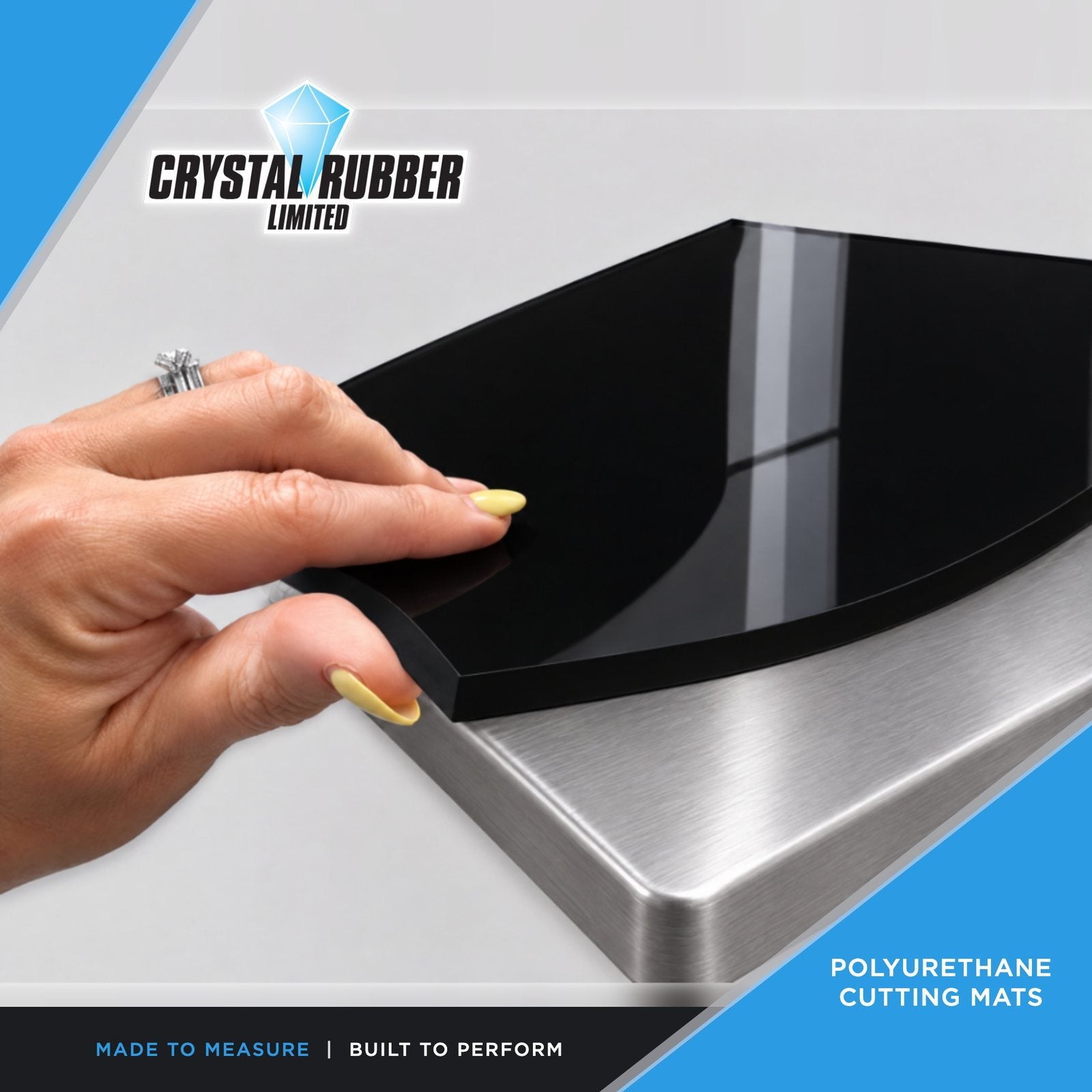 Black polyurethane cutting mat on a stainless steel bench
