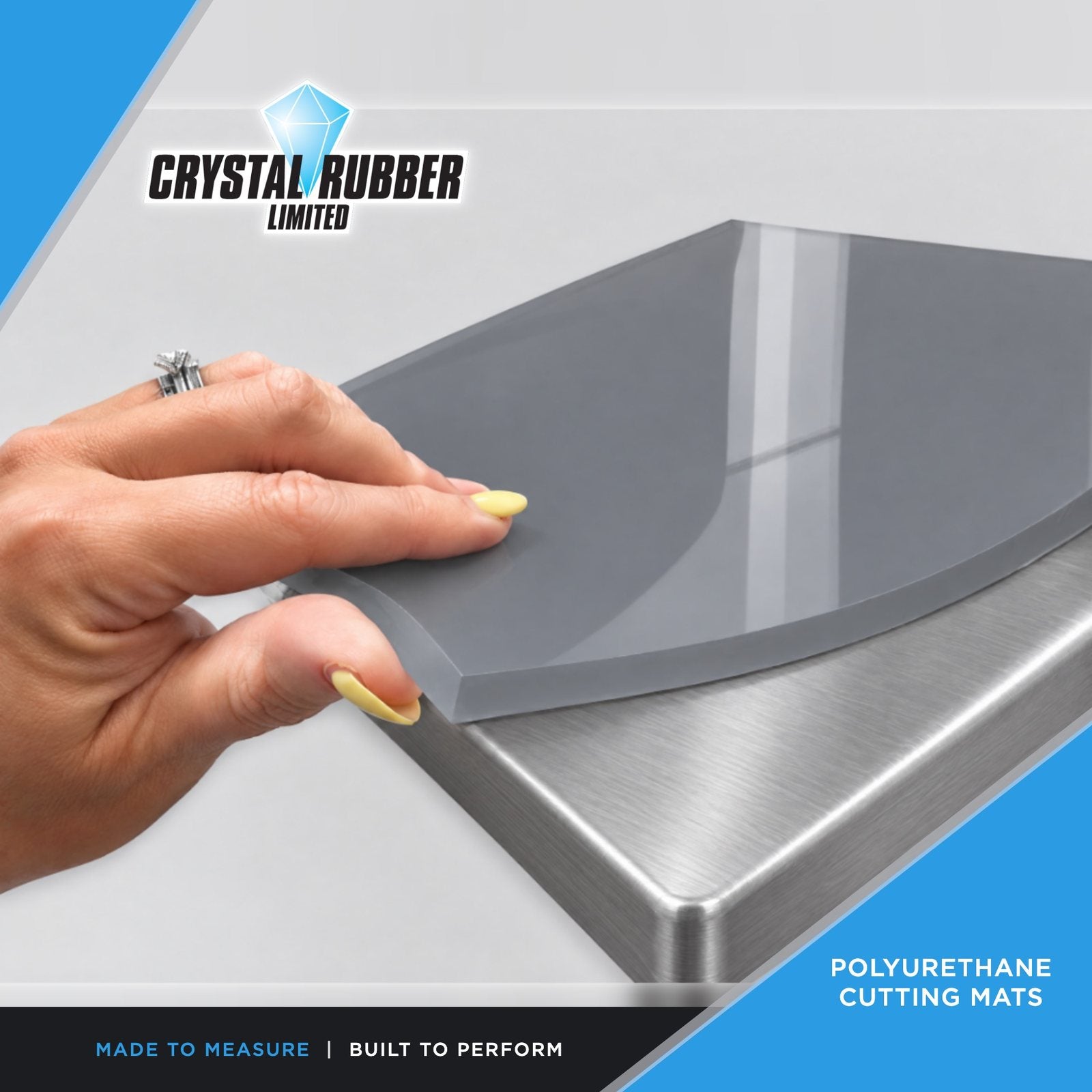 Grey polyurethane cutting mat on a stainless steel bench