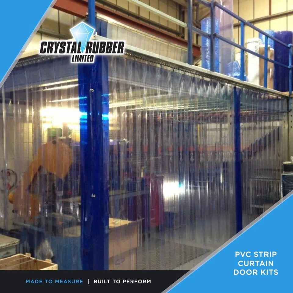 Clear PVC strip curtain enclosing a refrigerated area inside a factory