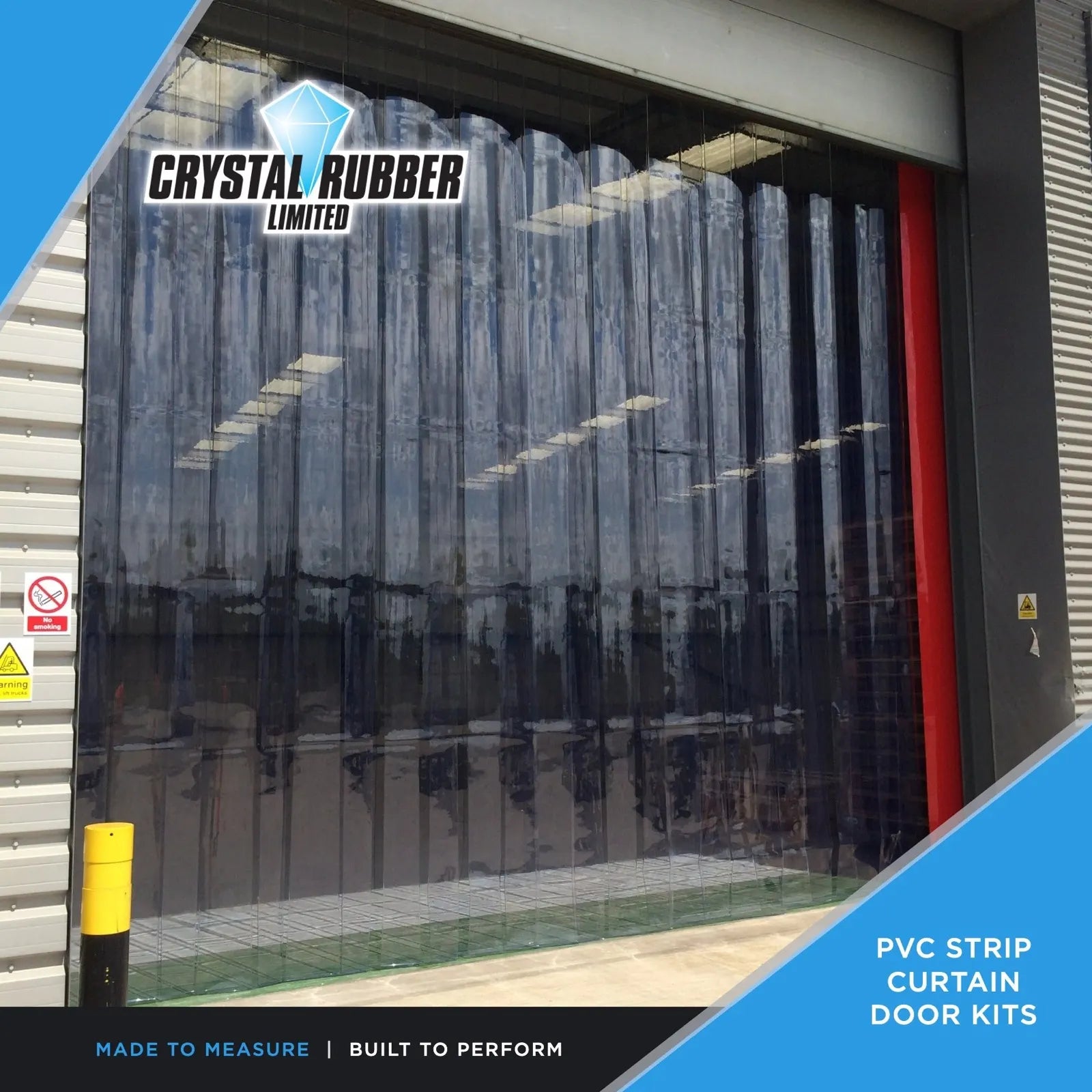 Clear PVC strip curtain hung across an industrial loading bay doorway, strips hanging straight to the floor
